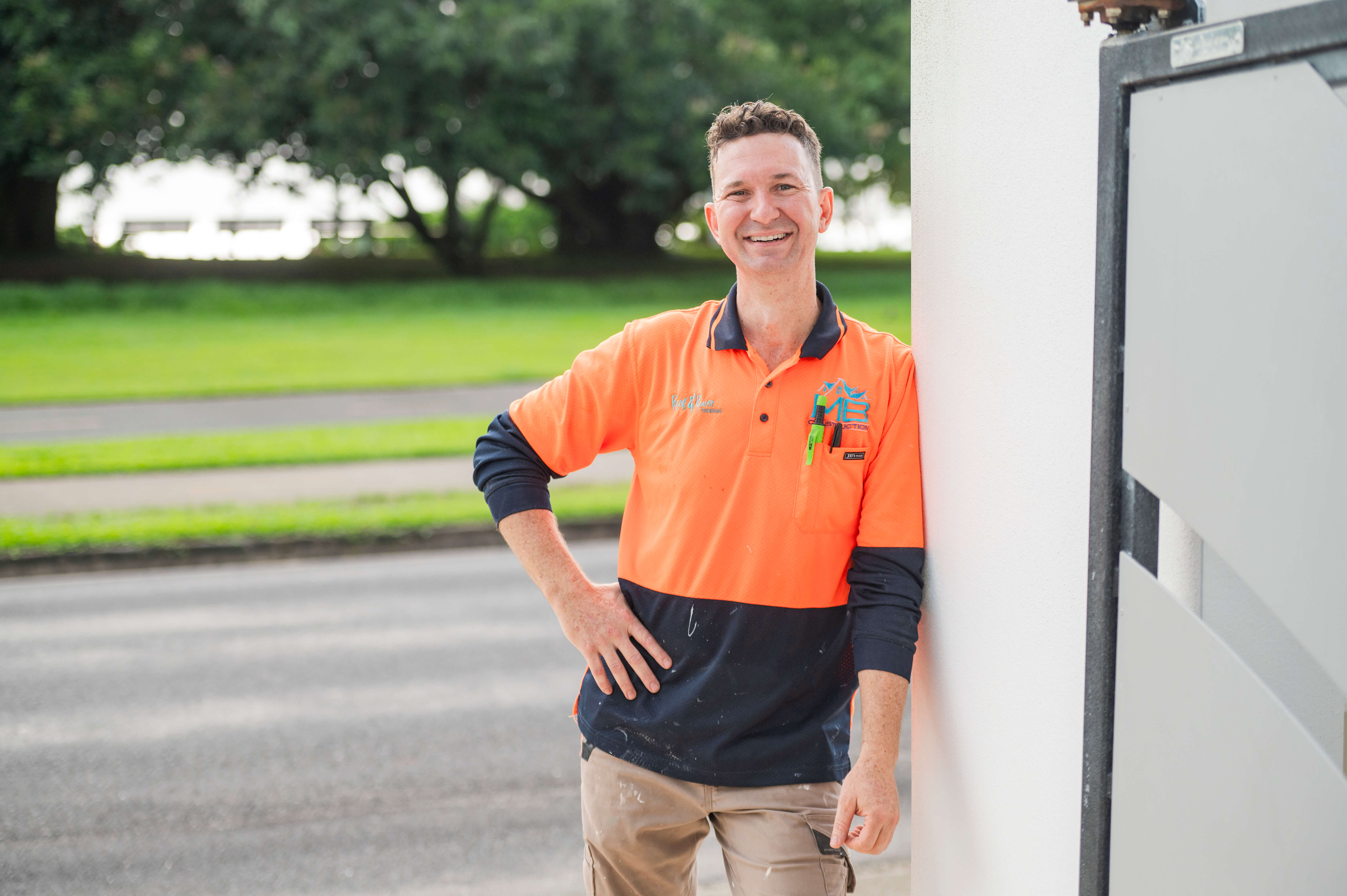 Image is decorative. Man in a high vis shirt standing in the doorway